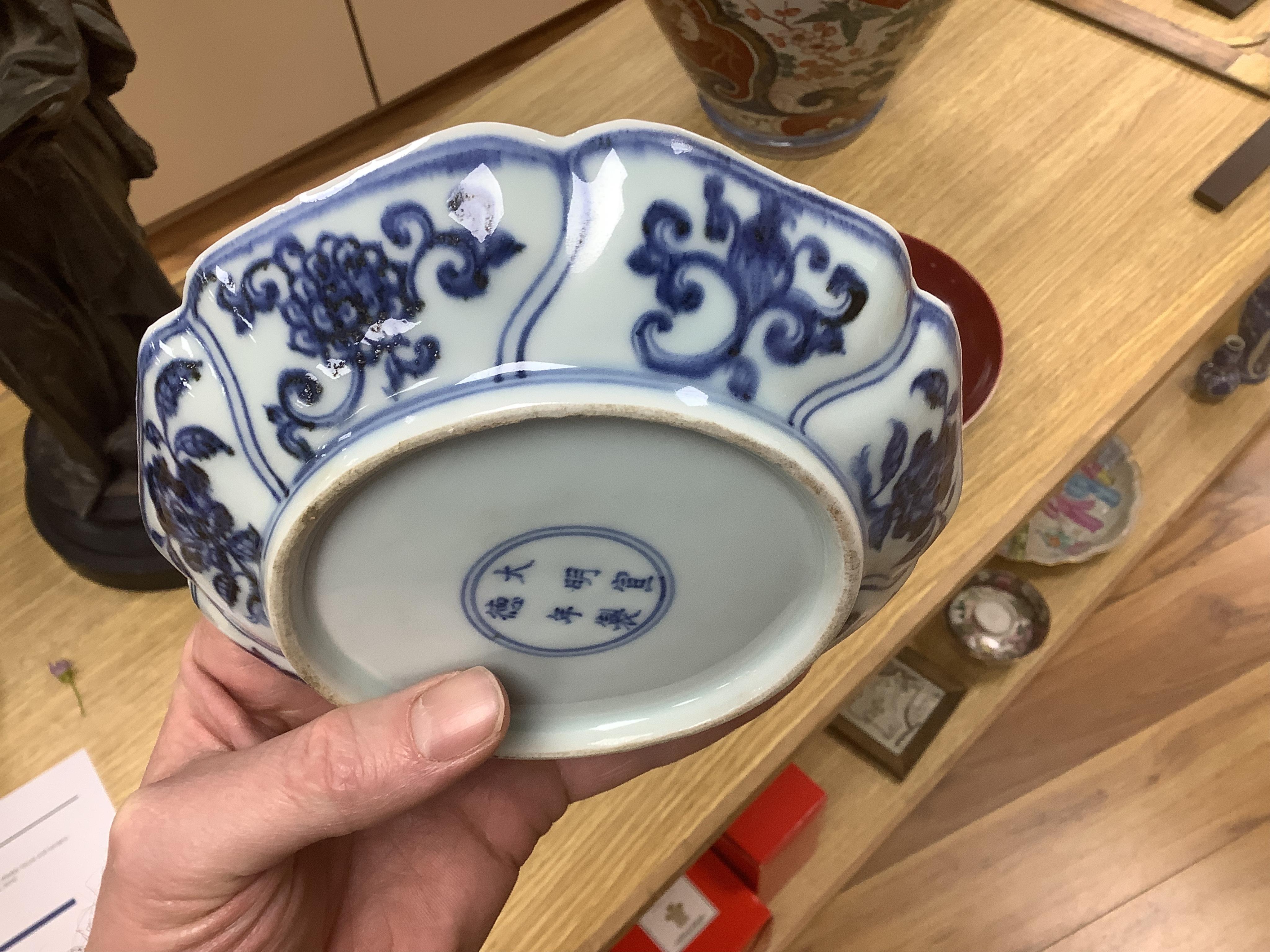 A Chinese copper red glazed dish, a blue and white bowl and a similar dish, bowl 22.5cm diameter. Condition - good